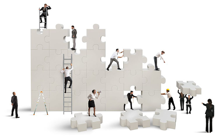 Business team Builds a new company with puzzle